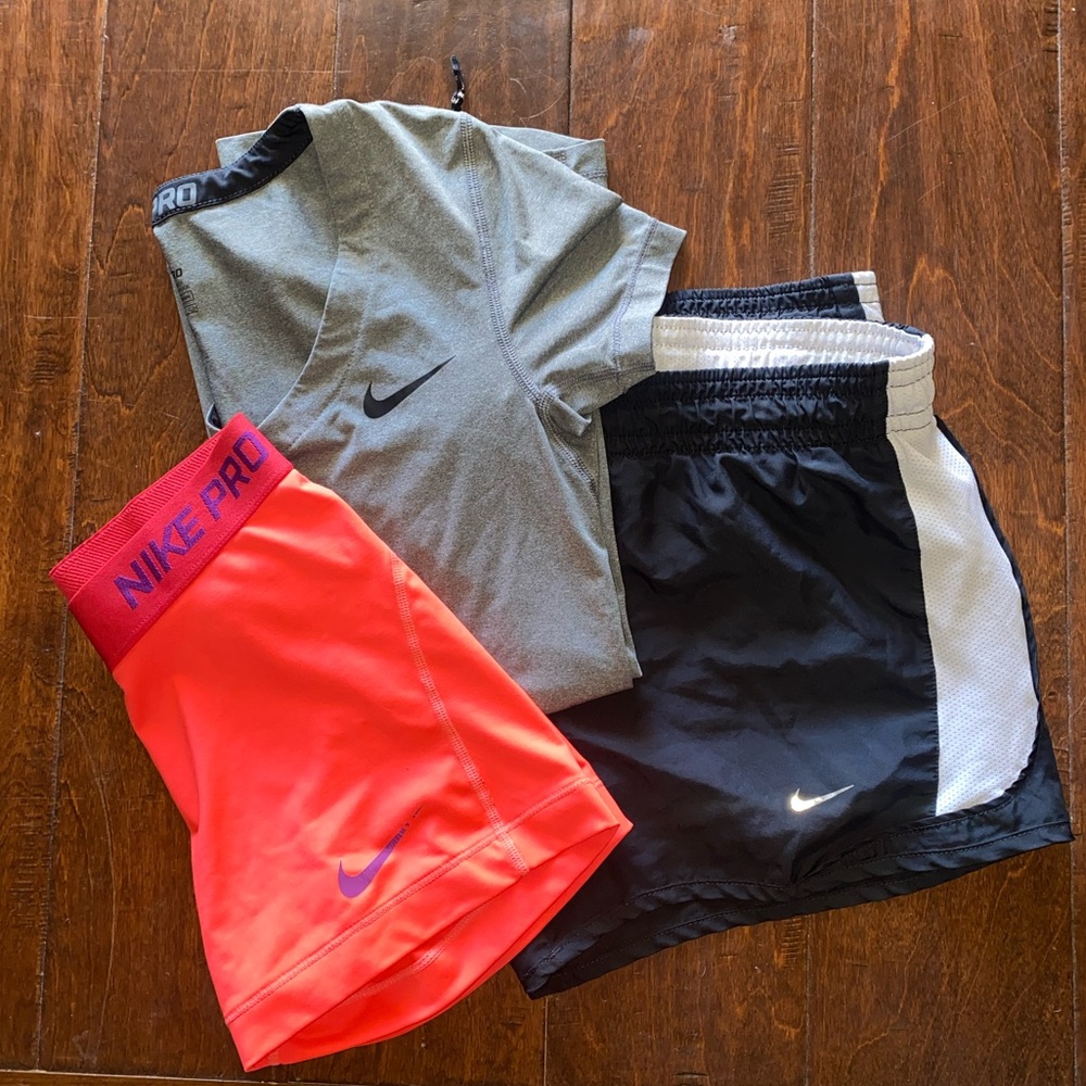 Small Nike clothes. Nike pro shirt, Nike pro spandex, Nike dri-fit shorts.